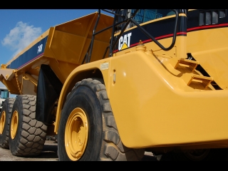AFTER >: Caterpillar 740 Articulated Dump Trucks
